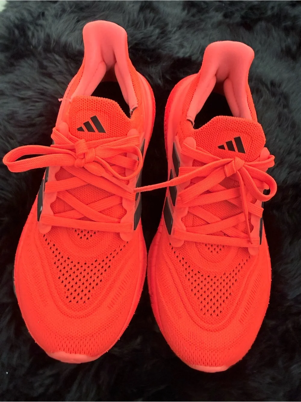 adidas red orange Ultraboost Running Sneakers.